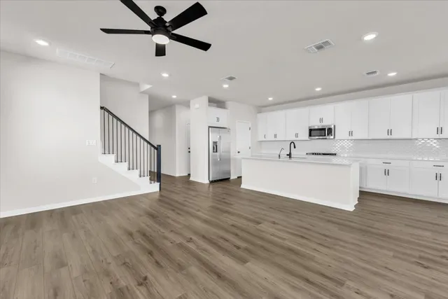a view of kitchen with wooden floor and window