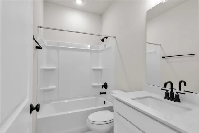 a bathroom with a sink a toilet and a bathtub