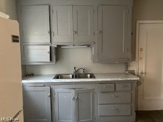 1508 Genesee Road South Euclid, OH 44121 - Photo 8 of 12 Kitchen with white fridge and light countertops