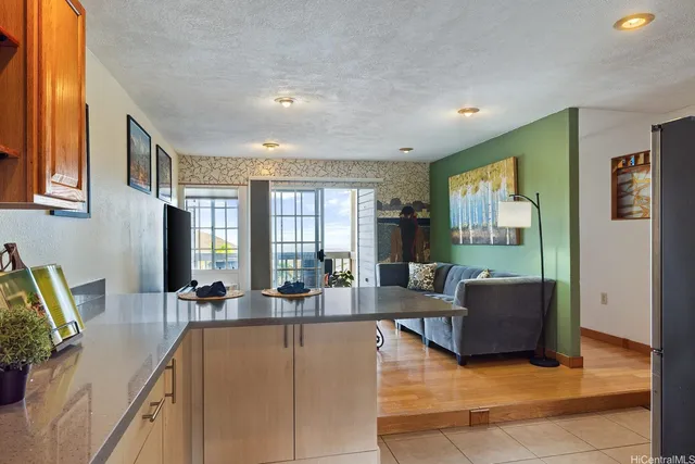 a living room with furniture window and wooden floor