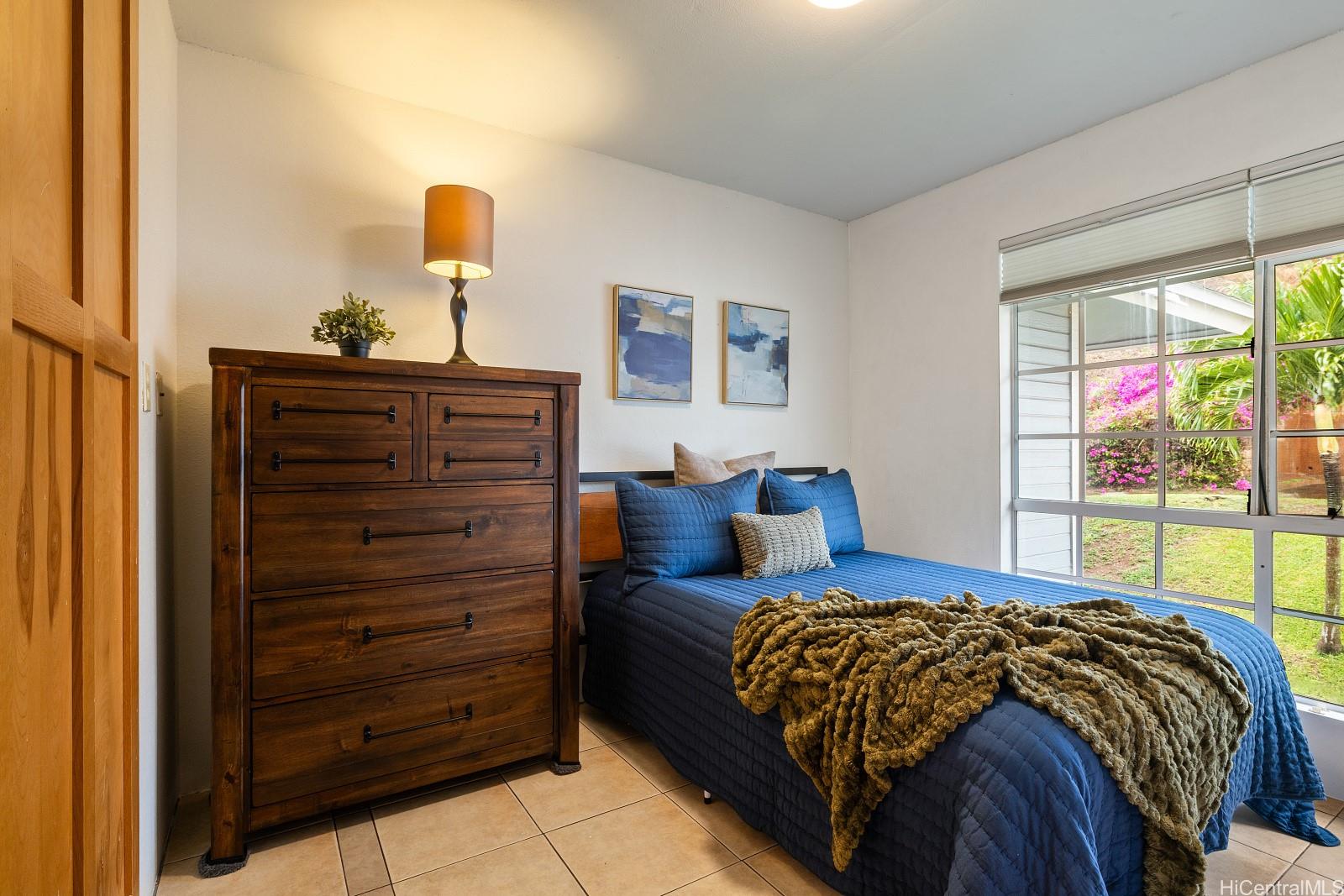 92-905 Hame Place, Unit 19203 Kapolei, HI 96707 - Photo 17 of 23 a bedroom with a bed and a window