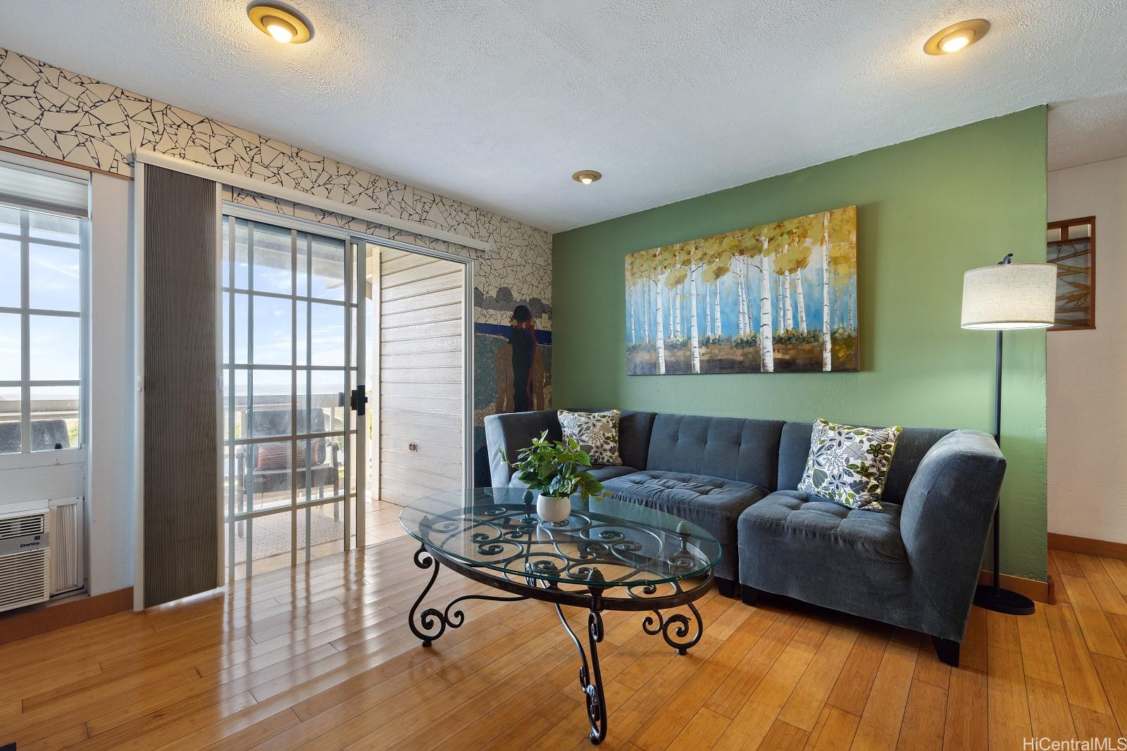 92-905 Hame Place, Unit 19203 Kapolei, HI 96707 - Photo 2 of 23 a living room with furniture and a window