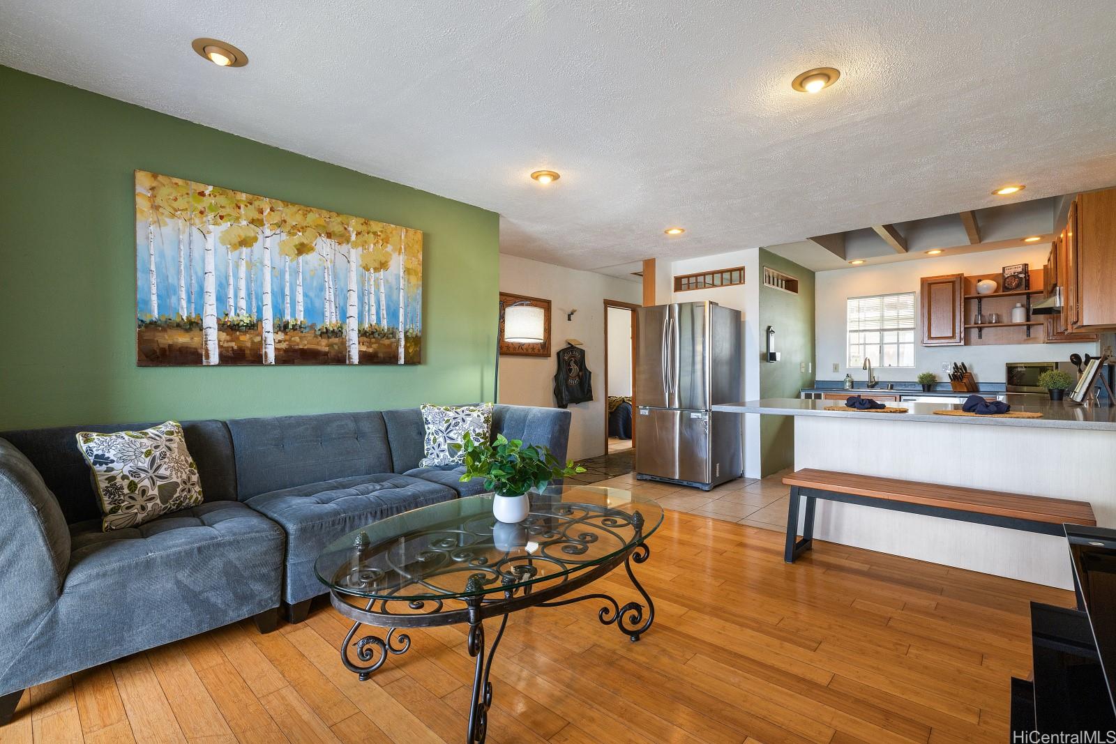 92-905 Hame Place, Unit 19203 Kapolei, HI 96707 - Photo 10 of 23 a living room with furniture and a large window