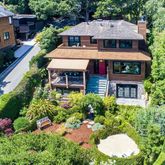 an aerial view of a house with a yard and potted plants