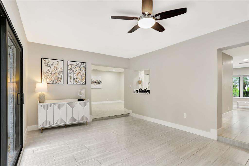 1035 Northwest 5th Avenue Boca Raton, FL 33432 - Photo 21 of 50 an empty room with windows and ceiling fan