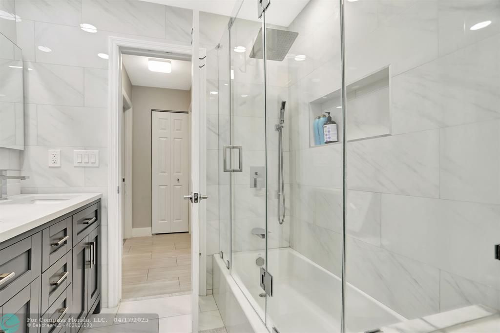 1035 Northwest 5th Avenue Boca Raton, FL 33432 - Photo 28 of 50 a bathroom with a shower and a sink