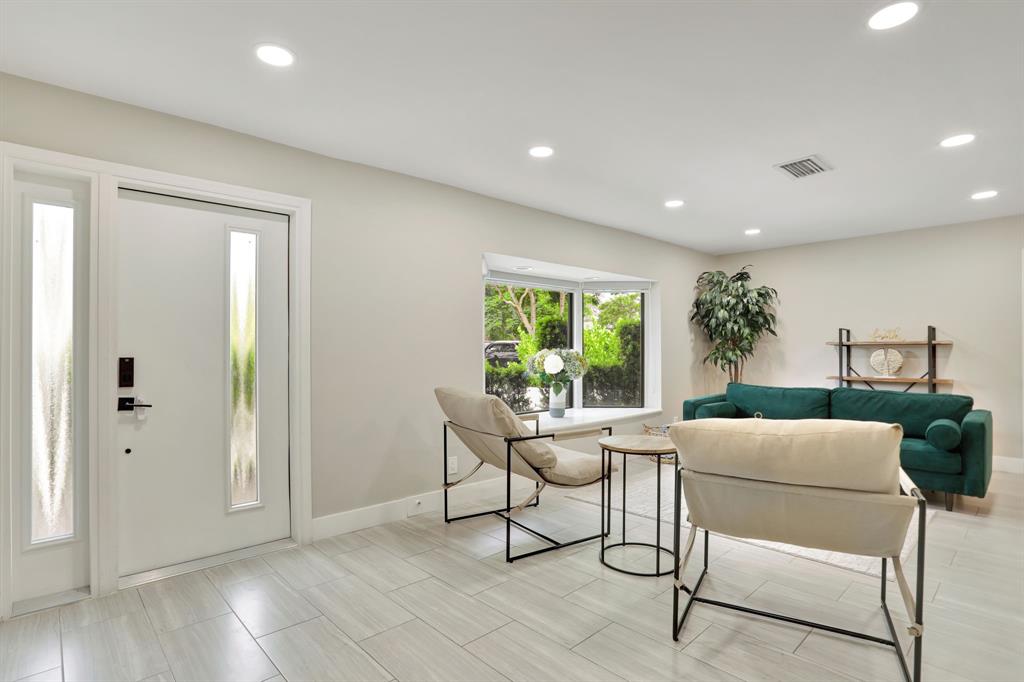 1035 Northwest 5th Avenue Boca Raton, FL 33432 - Photo 6 of 50 a living room with furniture and a window