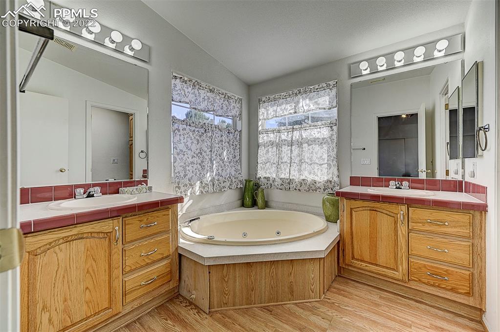 44560 Highway 50 Avondale, CO 81022 - Photo 19 of 50 a bathroom with a tub sink and mirror