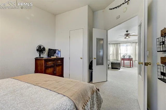 a bedroom with a bed and a television