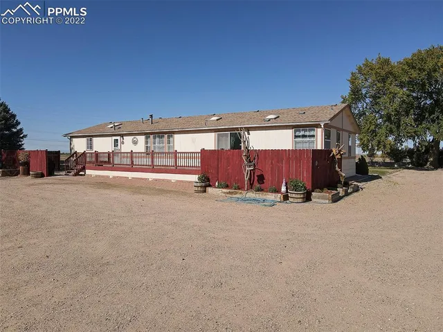 a view of a house with a yard and garage