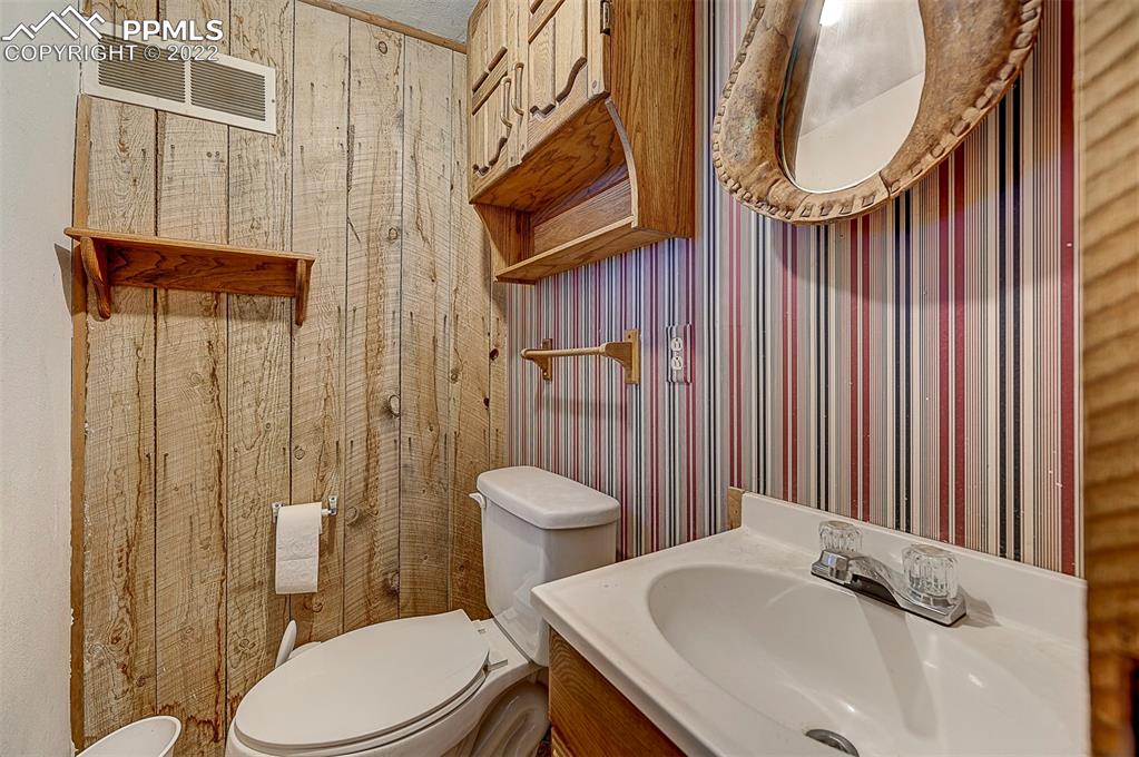 44560 Highway 50 Avondale, CO 81022 - Photo 32 of 50 a bathroom with a sink a toilet and shower curtain
