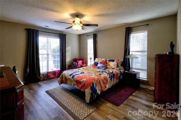 a bedroom with bed and window