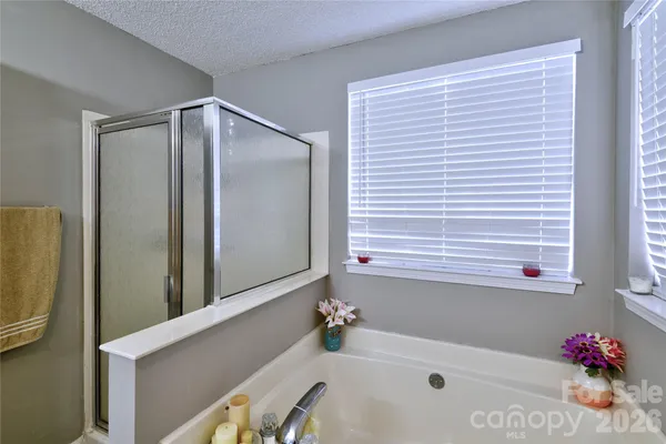 a bathroom with a bathtub and a sink