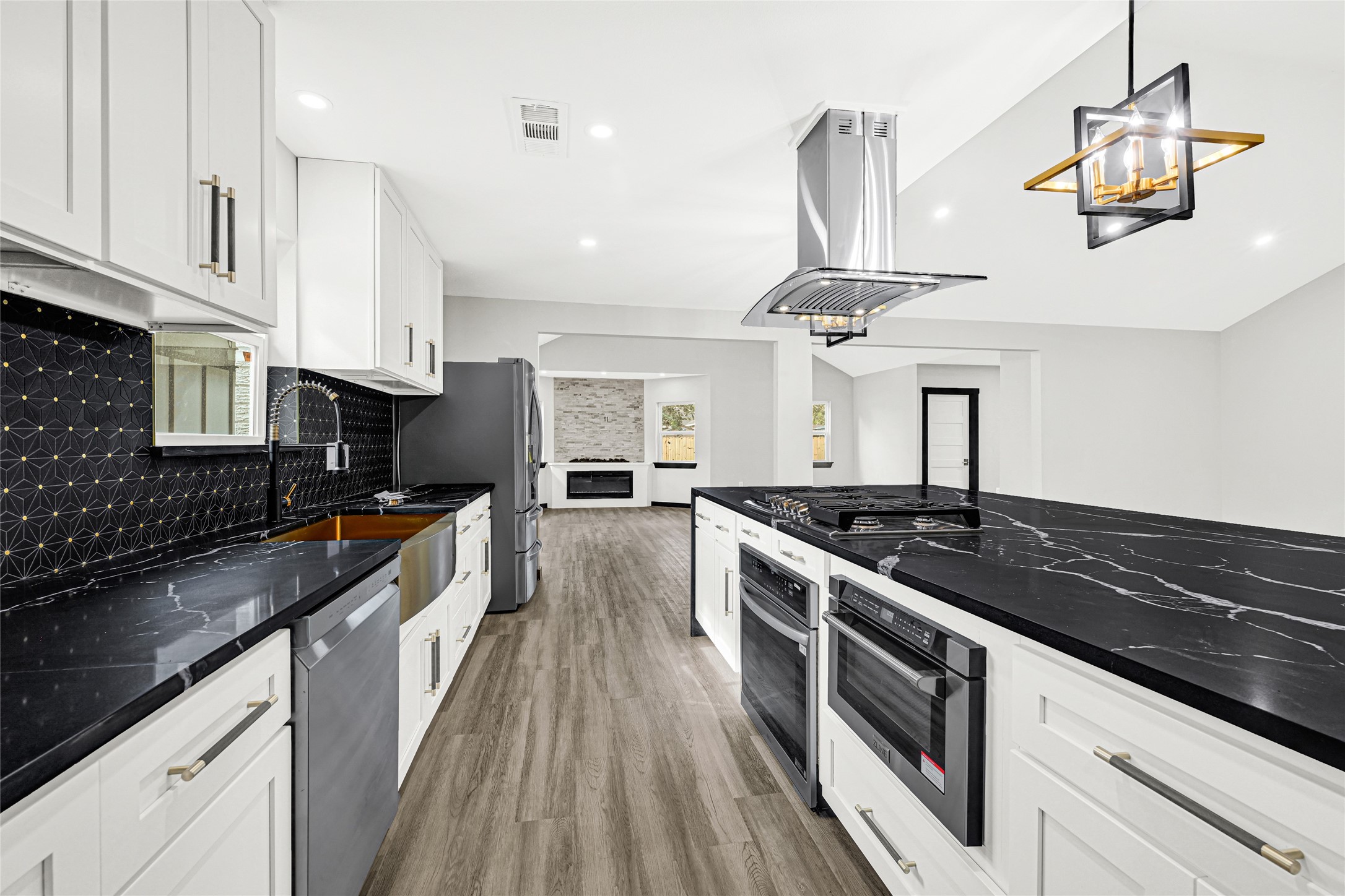 16240 2nd Street Rosharon, TX 77583 - Photo 11 of 26 a kitchen with stainless steel appliances granite countertop a sink a stove and cabinets