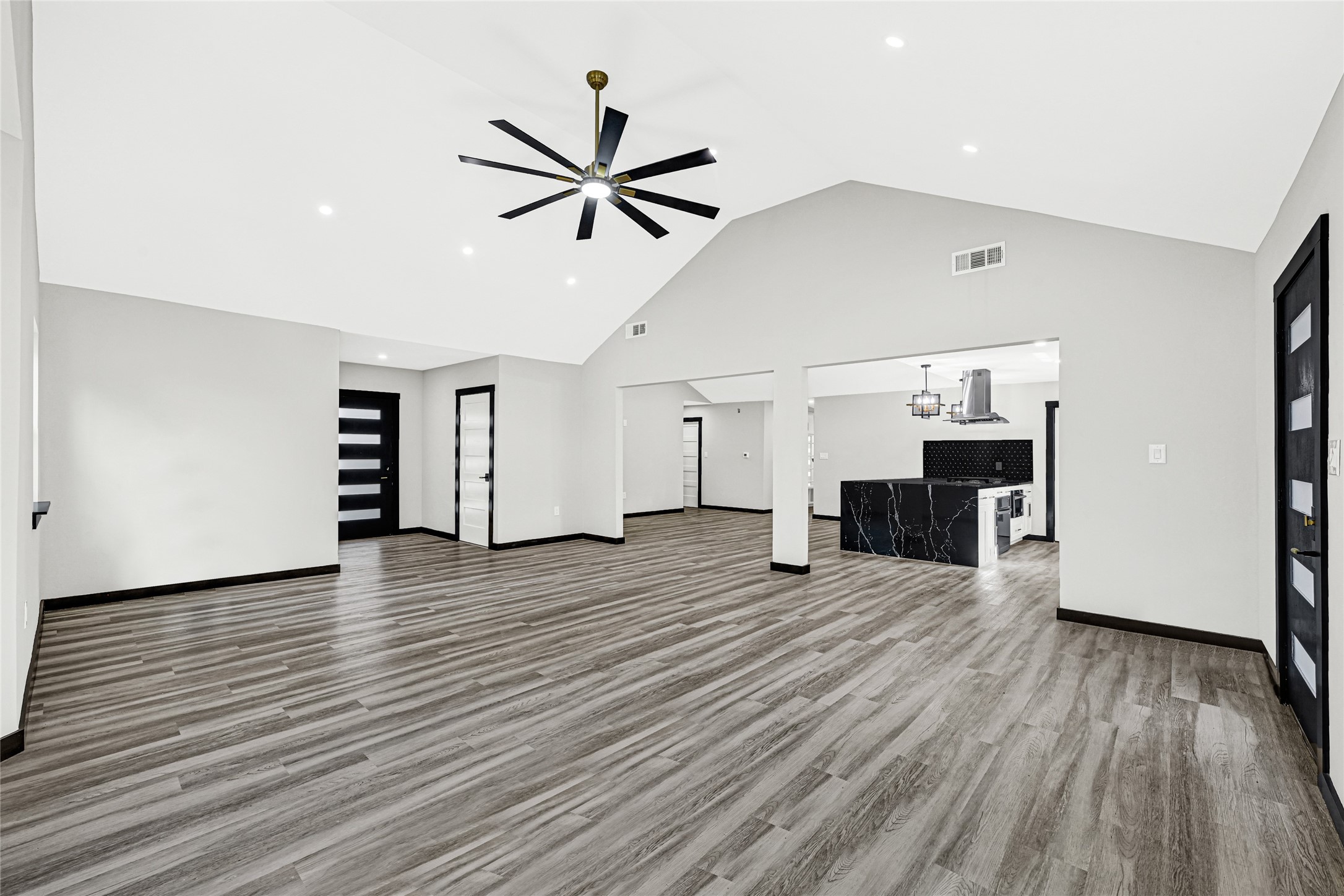 16240 2nd Street Rosharon, TX 77583 - Photo 14 of 26 a view of a room with wooden floor and a ceiling fan