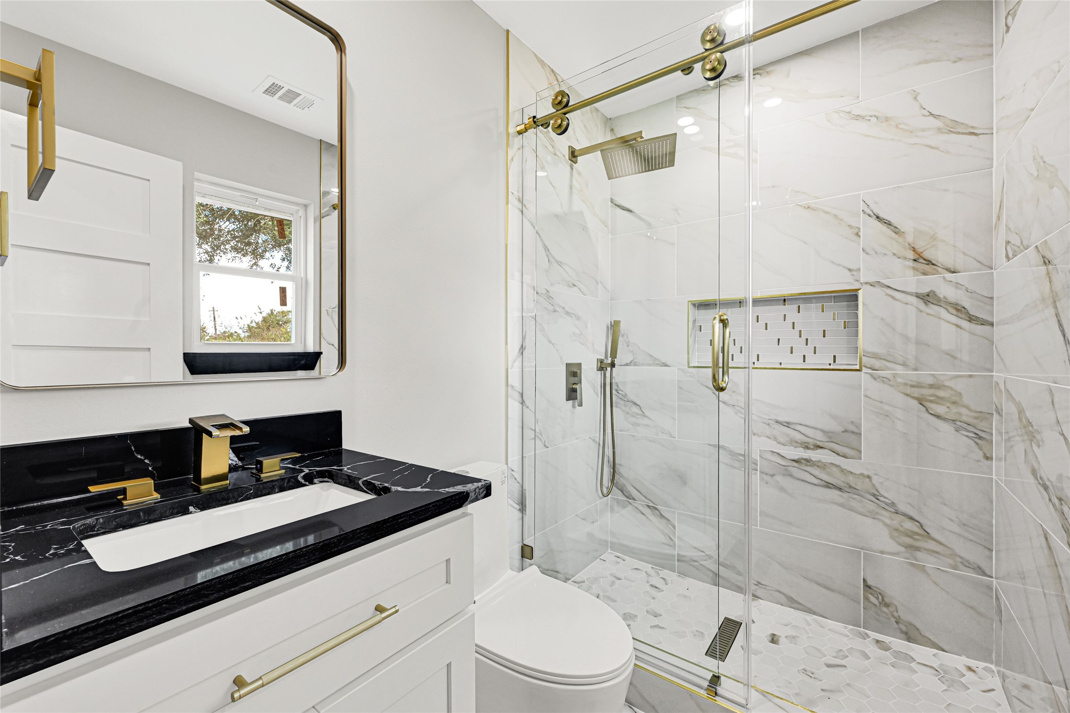 16240 2nd Street Rosharon, TX 77583 - Photo 19 of 26 a bathroom with a granite countertop sink toilet and shower
