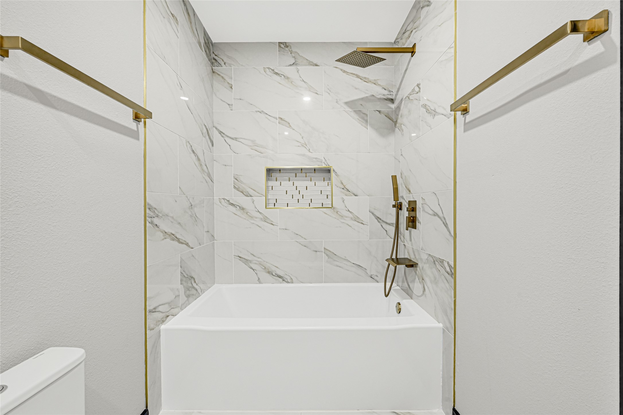 16240 2nd Street Rosharon, TX 77583 - Photo 21 of 26 a bathroom with a white bath tub a shower and a sink