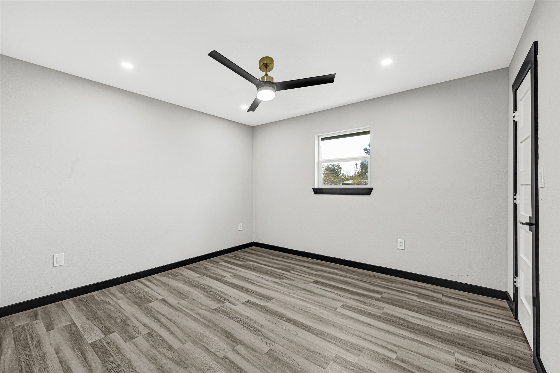 16240 2nd Street Rosharon, TX 77583 - Photo 22 of 26 a view of a big room with wooden floor and windows