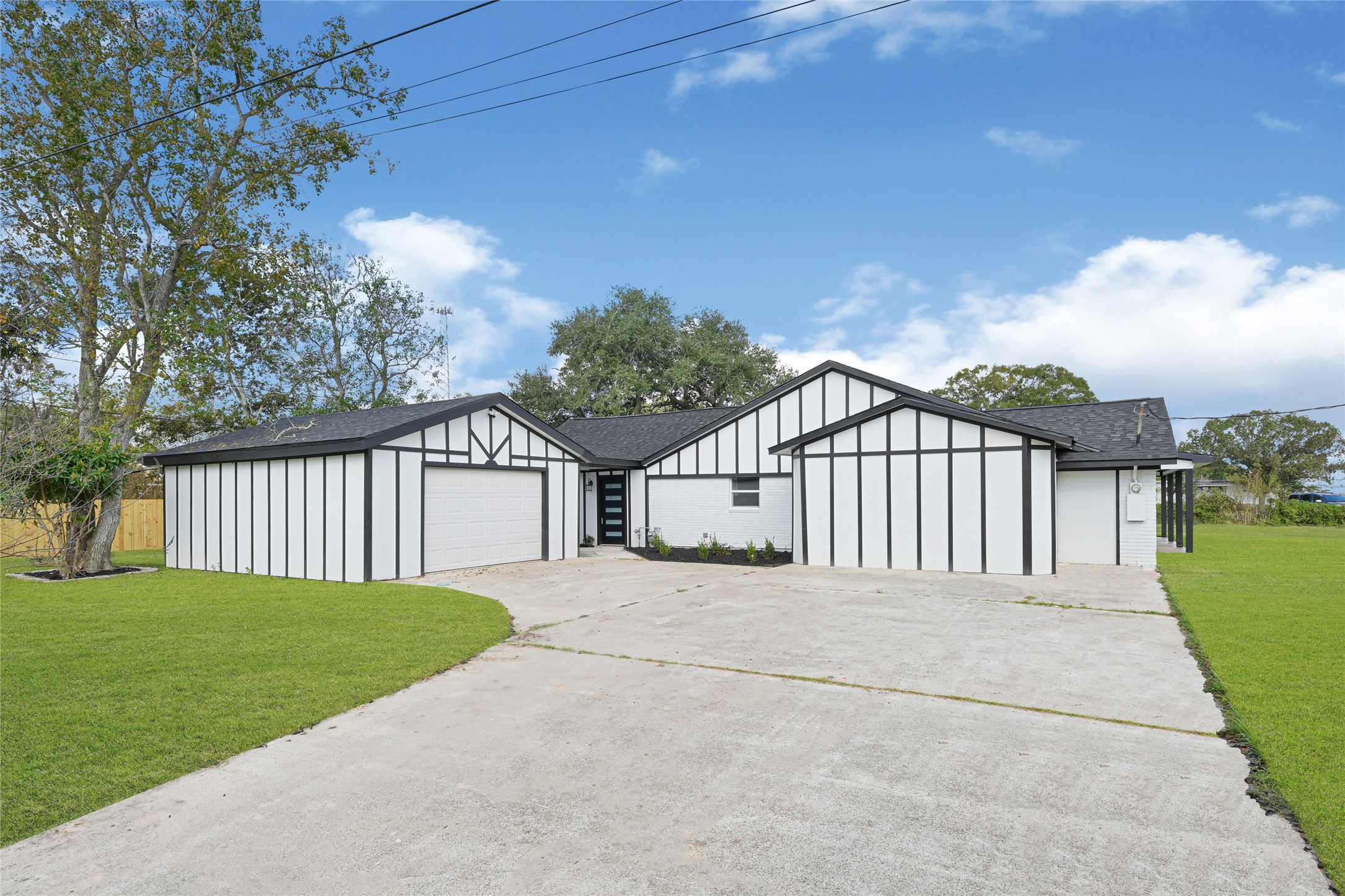 16240 2nd Street Rosharon, TX 77583 - Photo 25 of 26 a view of a house with a small yard and a large tree