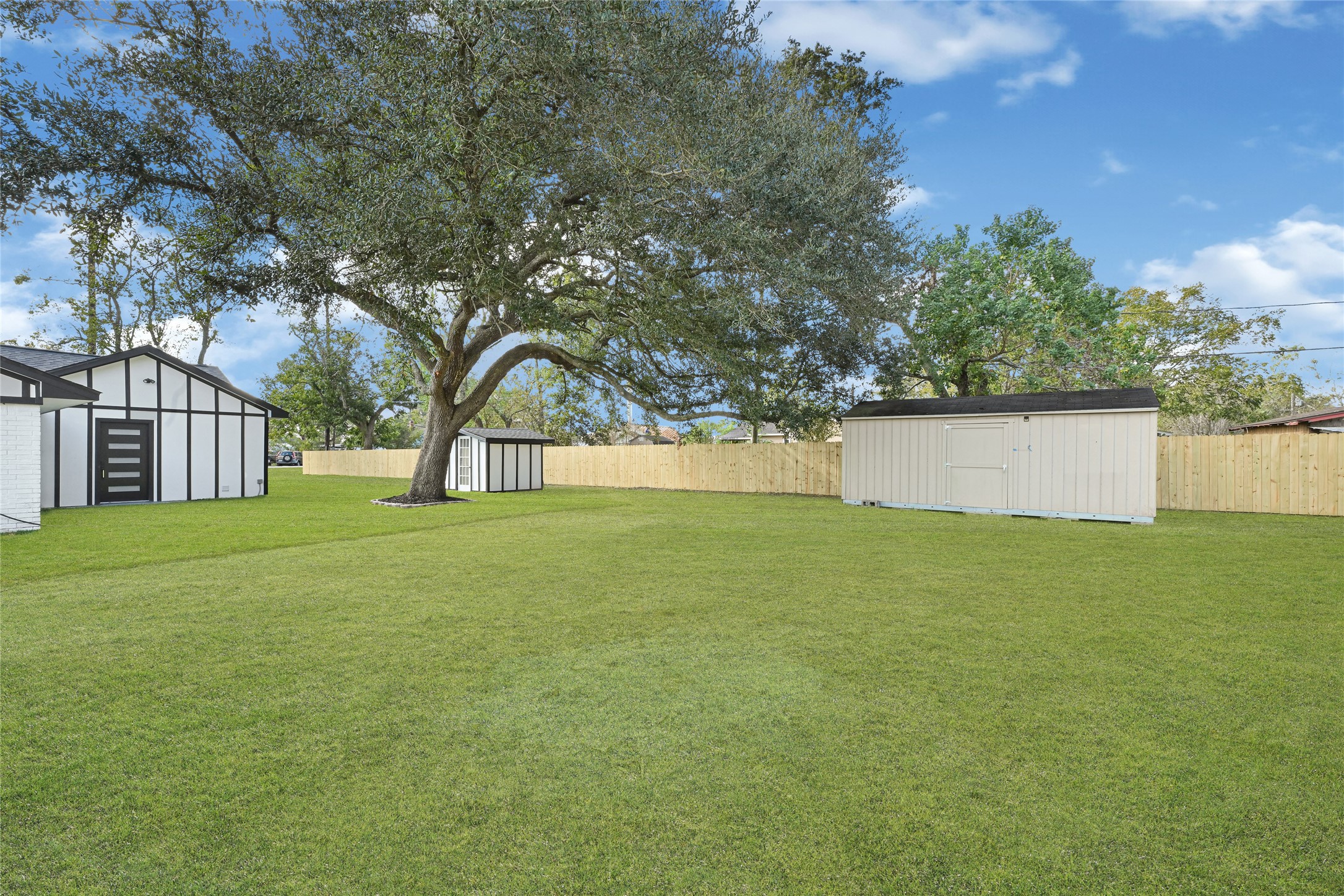 16240 2nd Street Rosharon, TX 77583 - Photo 26 of 26 a view of outdoor space with deck and tree