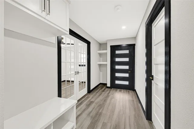 wooden floor in an empty room with a window