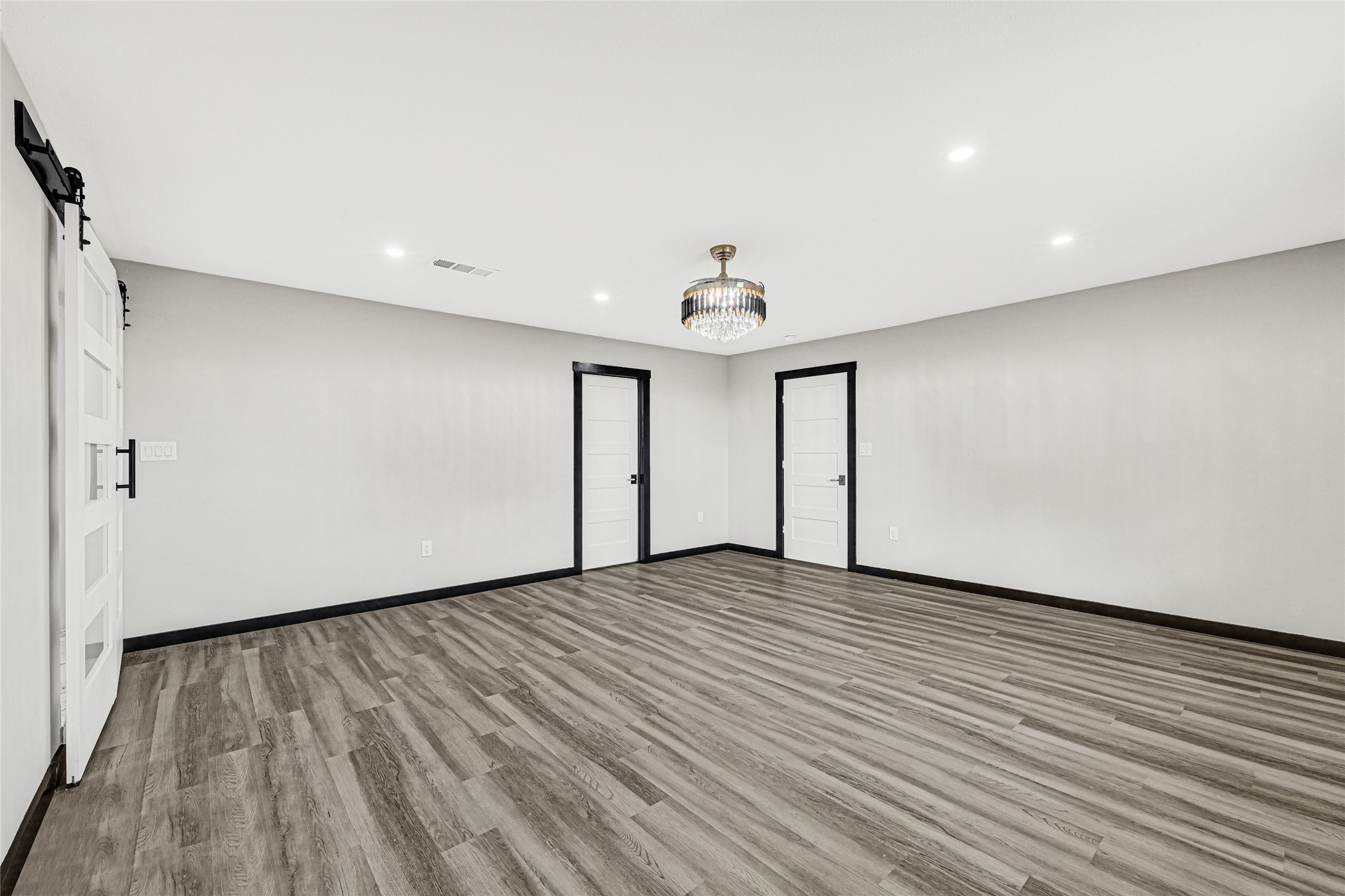 16240 2nd Street Rosharon, TX 77583 - Photo 5 of 26 a view of an empty room with wooden floor and a window