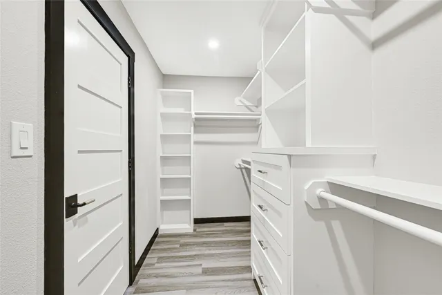 a kitchen with stainless steel appliances a stove a sink and a refrigerator