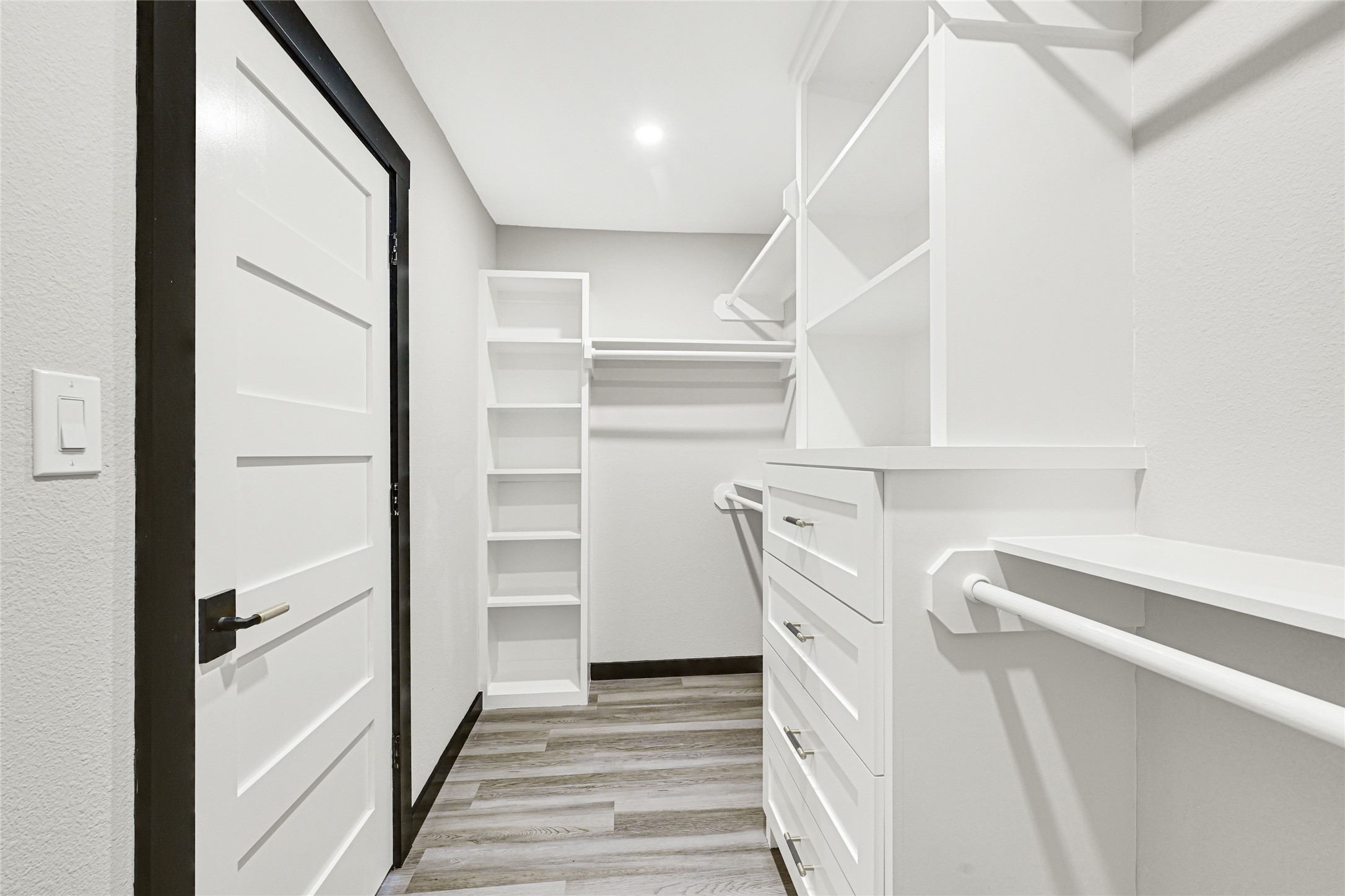 16240 2nd Street Rosharon, TX 77583 - Photo 6 of 26 a view of walk in closet with empty racks