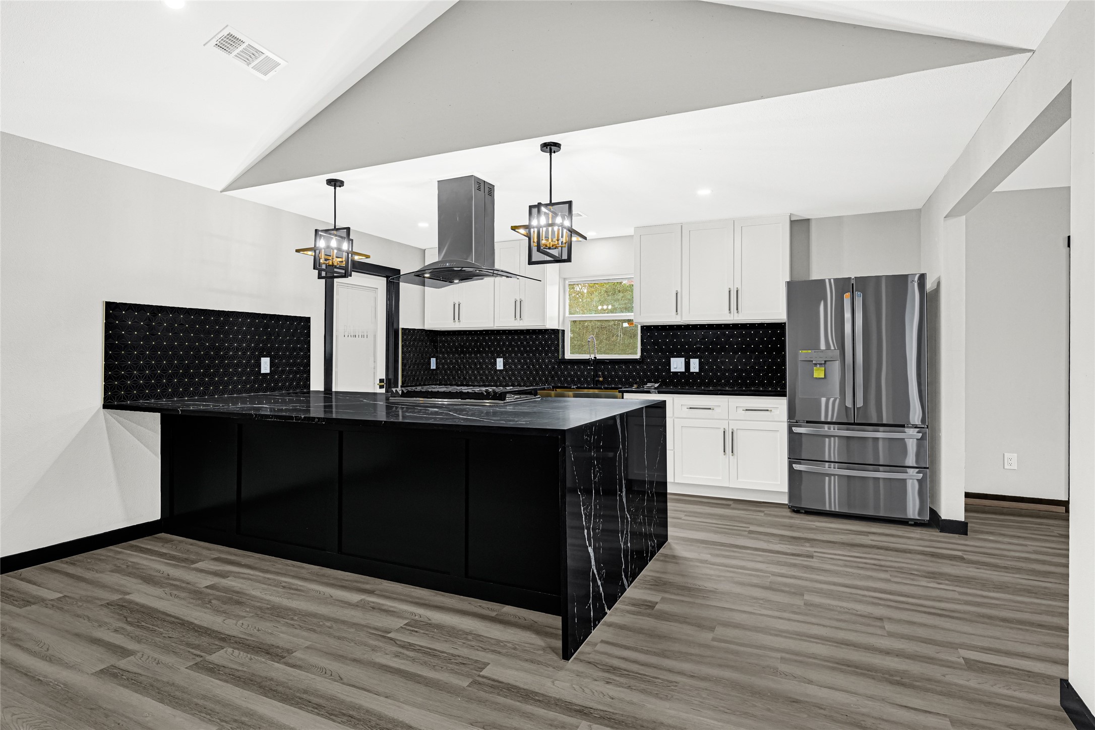 16240 2nd Street Rosharon, TX 77583 - Photo 9 of 26 a kitchen with stainless steel appliances a refrigerator and stove