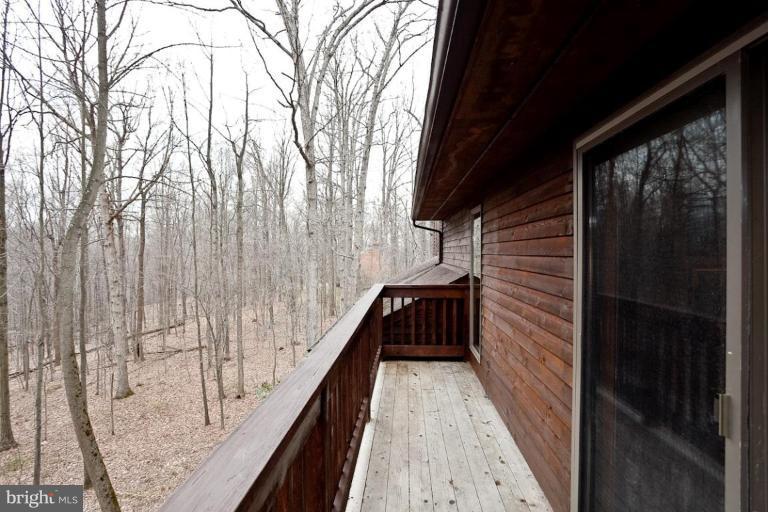 2122 Carroll Mill Road Phoenix, MD 21131 - Photo 14 of 18 a view of balcony with wooden floor and fence