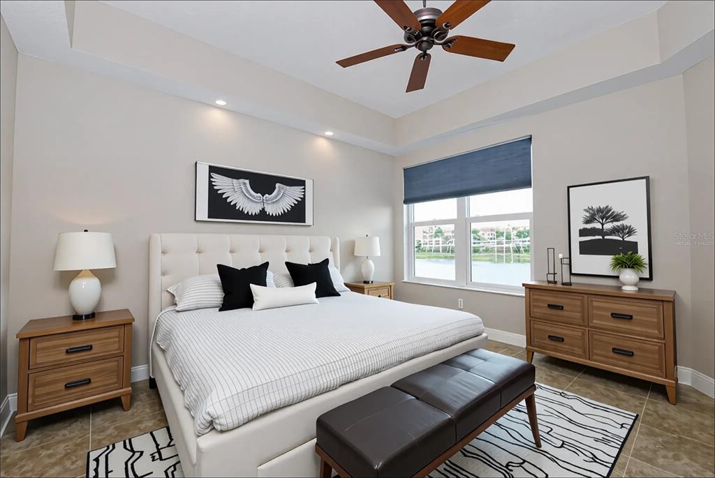 10520 Boardwalk Loop, Unit 202 Bradenton, FL 34202 - Photo 11 of 23 a bedroom with a bed and a dresser