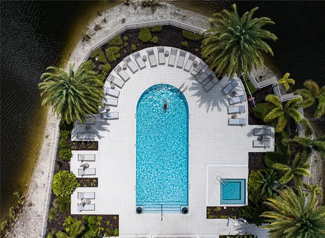a view of swimming pool with a table and chairs