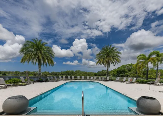 a view of a balcony with a table and chairs