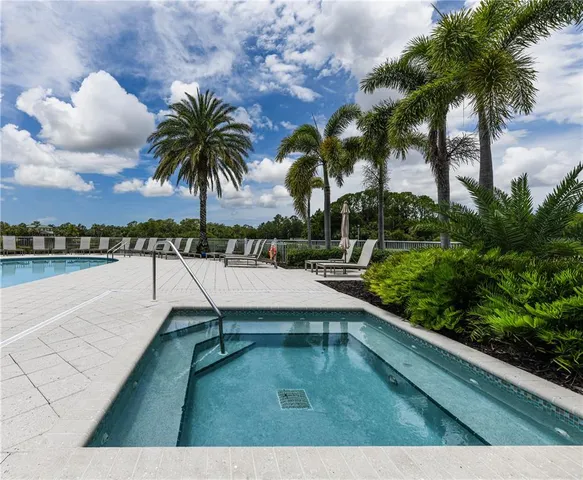 a living room with fireplace furniture and a flat screen tv
