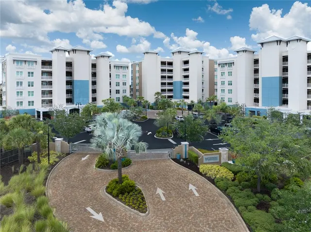 a view of building with garden space and barbeque oven