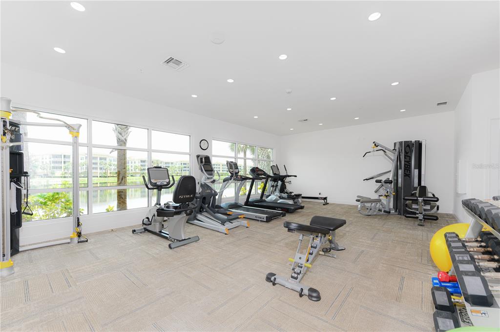10520 Boardwalk Loop, Unit 202 Bradenton, FL 34202 - Photo 22 of 23 a view of a room with gym equipment