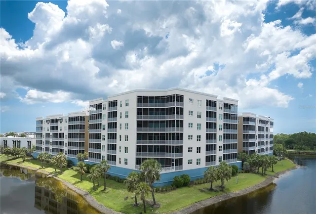 a bedroom with furniture and a large window
