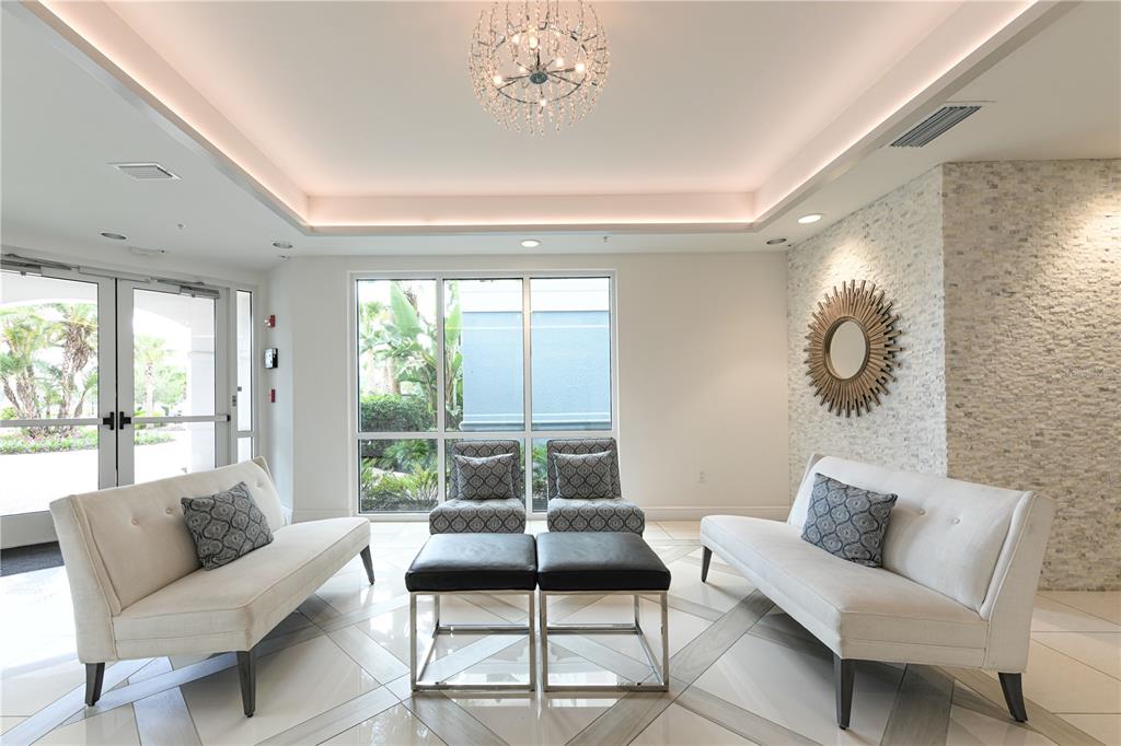 10520 Boardwalk Loop, Unit 202 Bradenton, FL 34202 - Photo 4 of 23 a bedroom with furniture and a large window