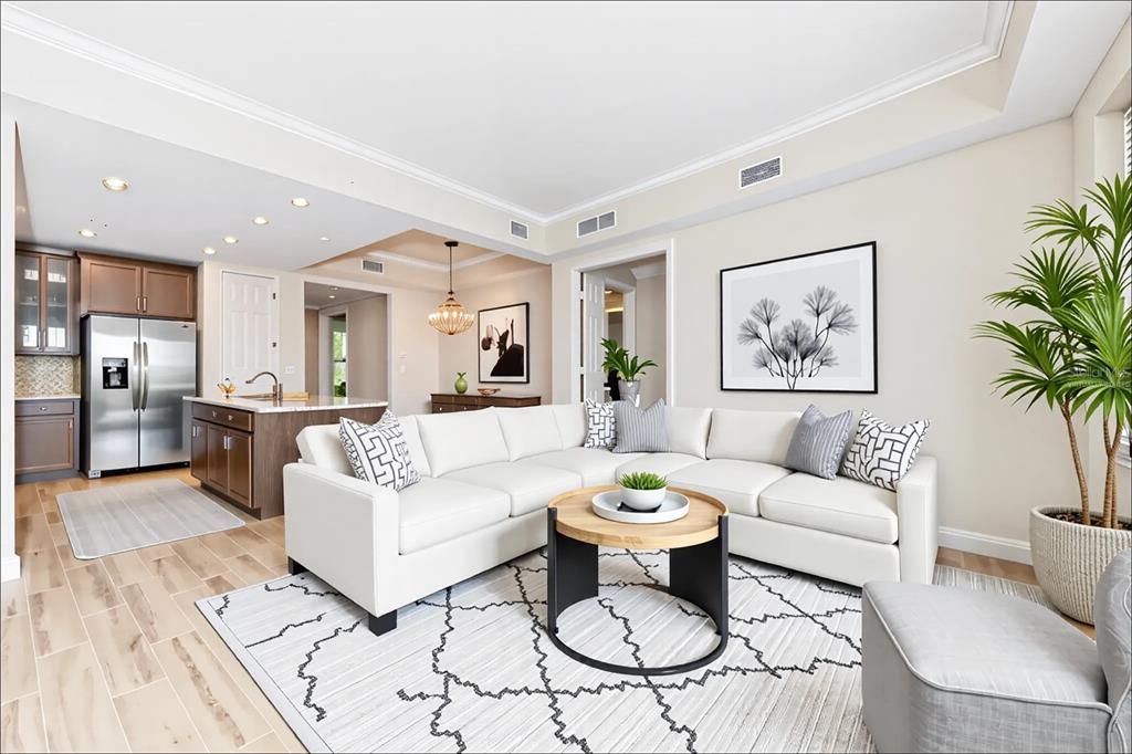 10520 Boardwalk Loop, Unit 202 Bradenton, FL 34202 - Photo 8 of 23 a living room with furniture kitchen and a table