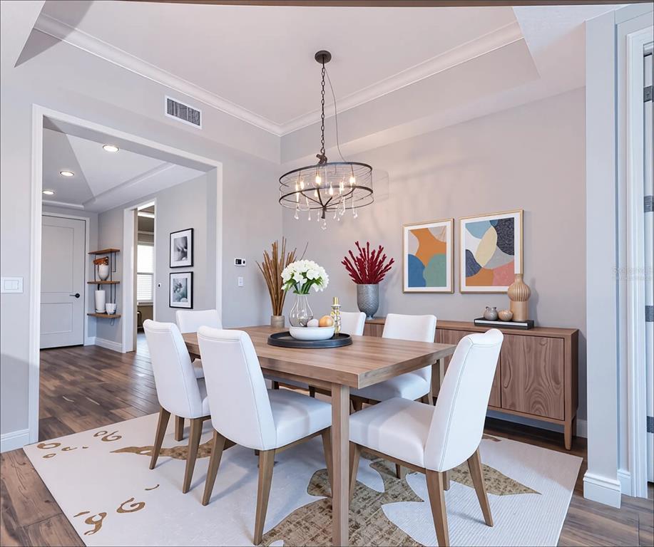 10520 Boardwalk Loop, Unit 202 Bradenton, FL 34202 - Photo 9 of 23 a view of a dining room with furniture window and wooden floor