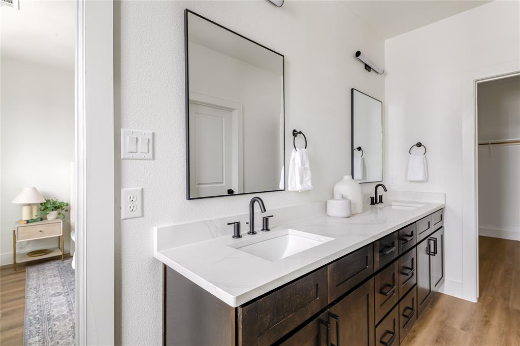 13325 Bee Street, Unit 302 Farmers Branch, TX 75234 - Photo 15 of 23 a bathroom with a sink and a mirror