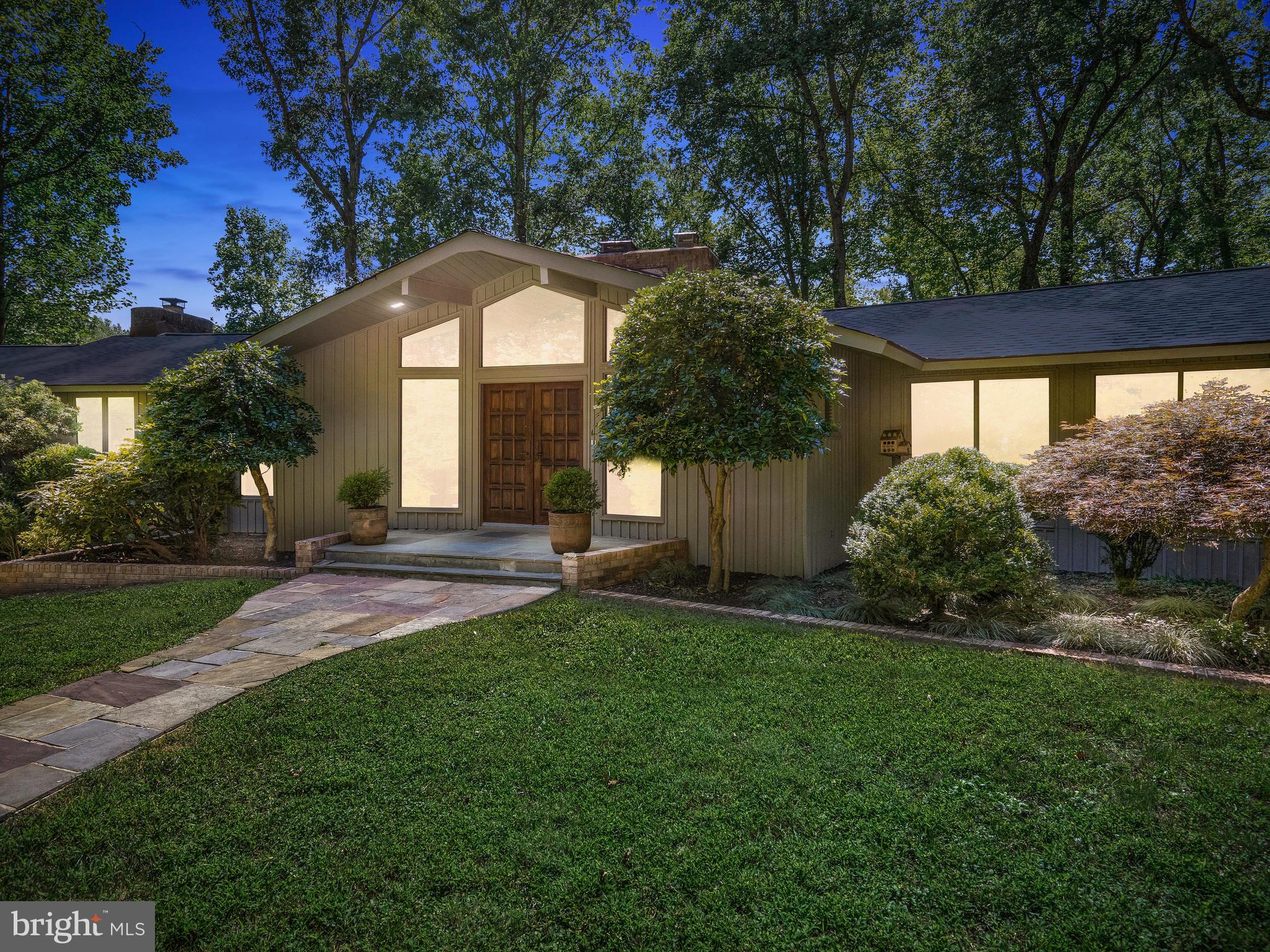 10420 Glen Road Potomac, MD 20854 - Photo 1 of 54 a front view of a house with a yard