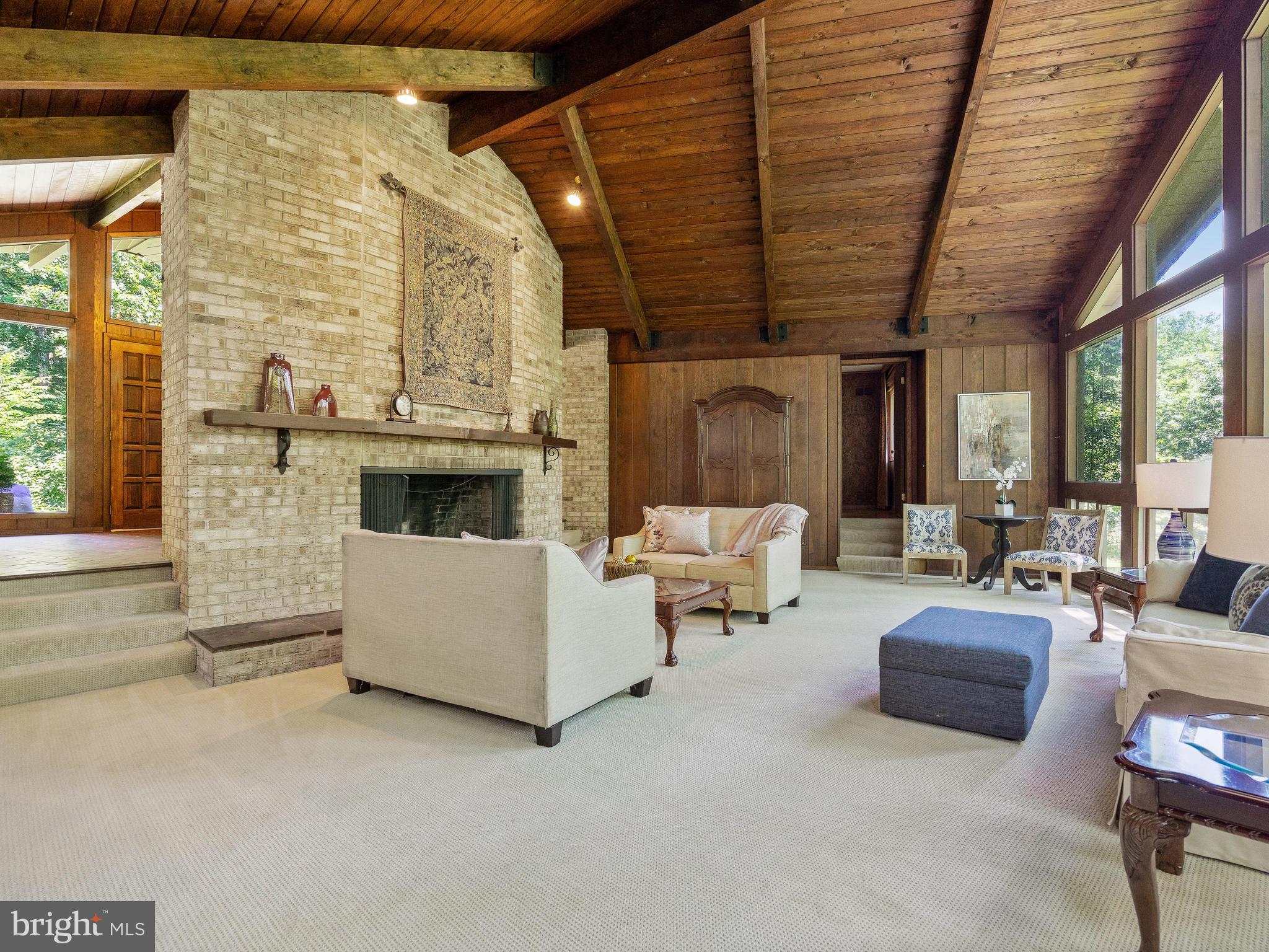 10420 Glen Road Potomac, MD 20854 - Photo 11 of 54 a living room with furniture and a fireplace