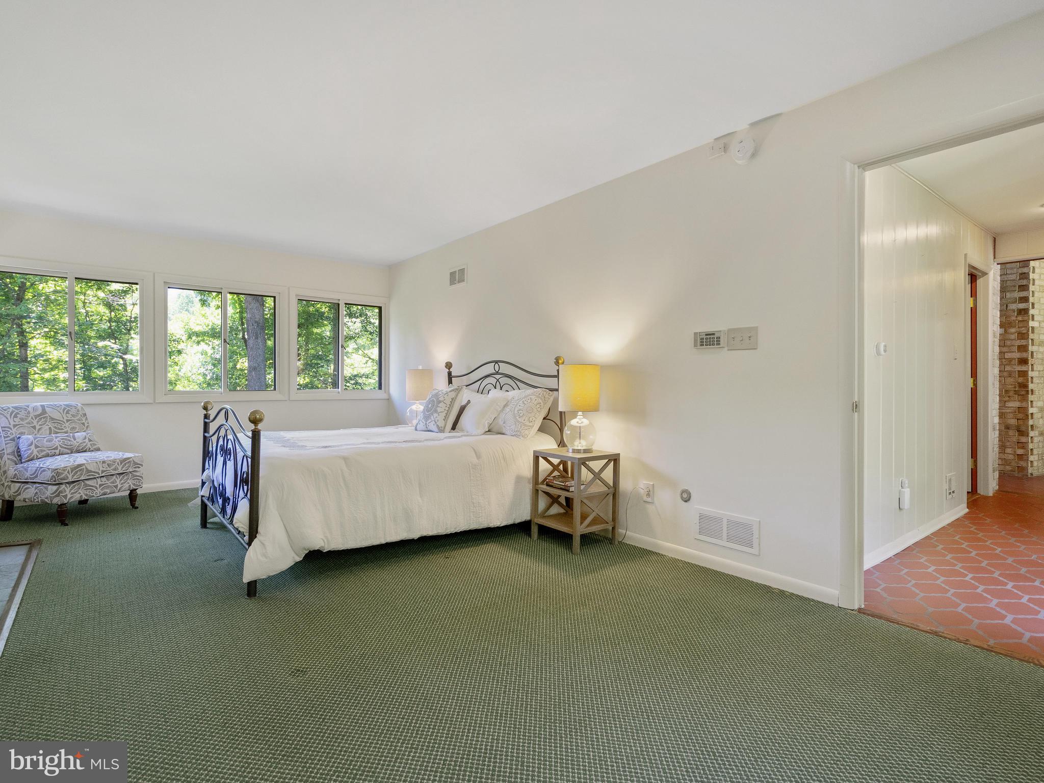 10420 Glen Road Potomac, MD 20854 - Photo 16 of 54 a bedroom with a bed and a window