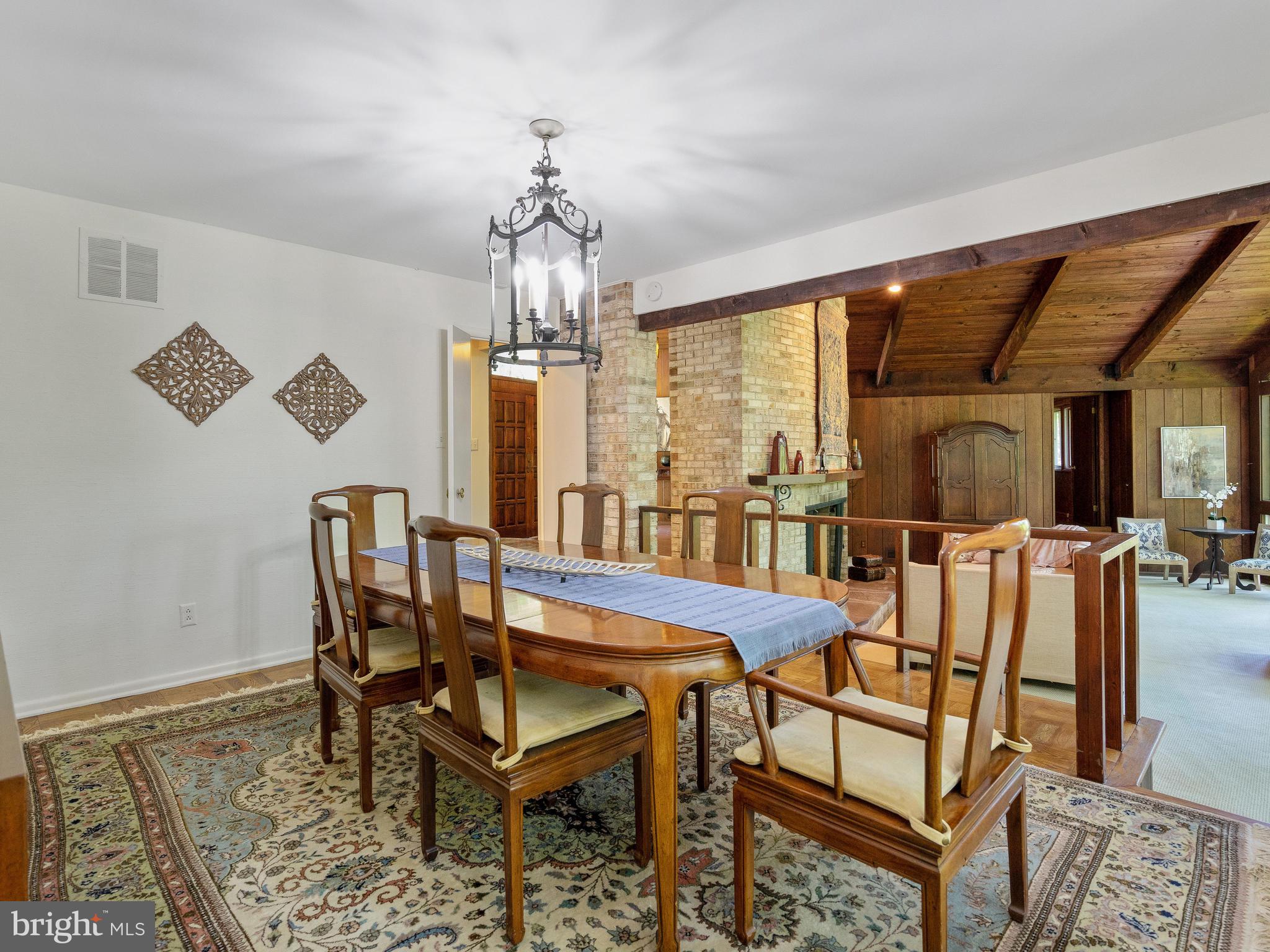 10420 Glen Road Potomac, MD 20854 - Photo 22 of 54 a view of a dining room with furniture and a chandelier
