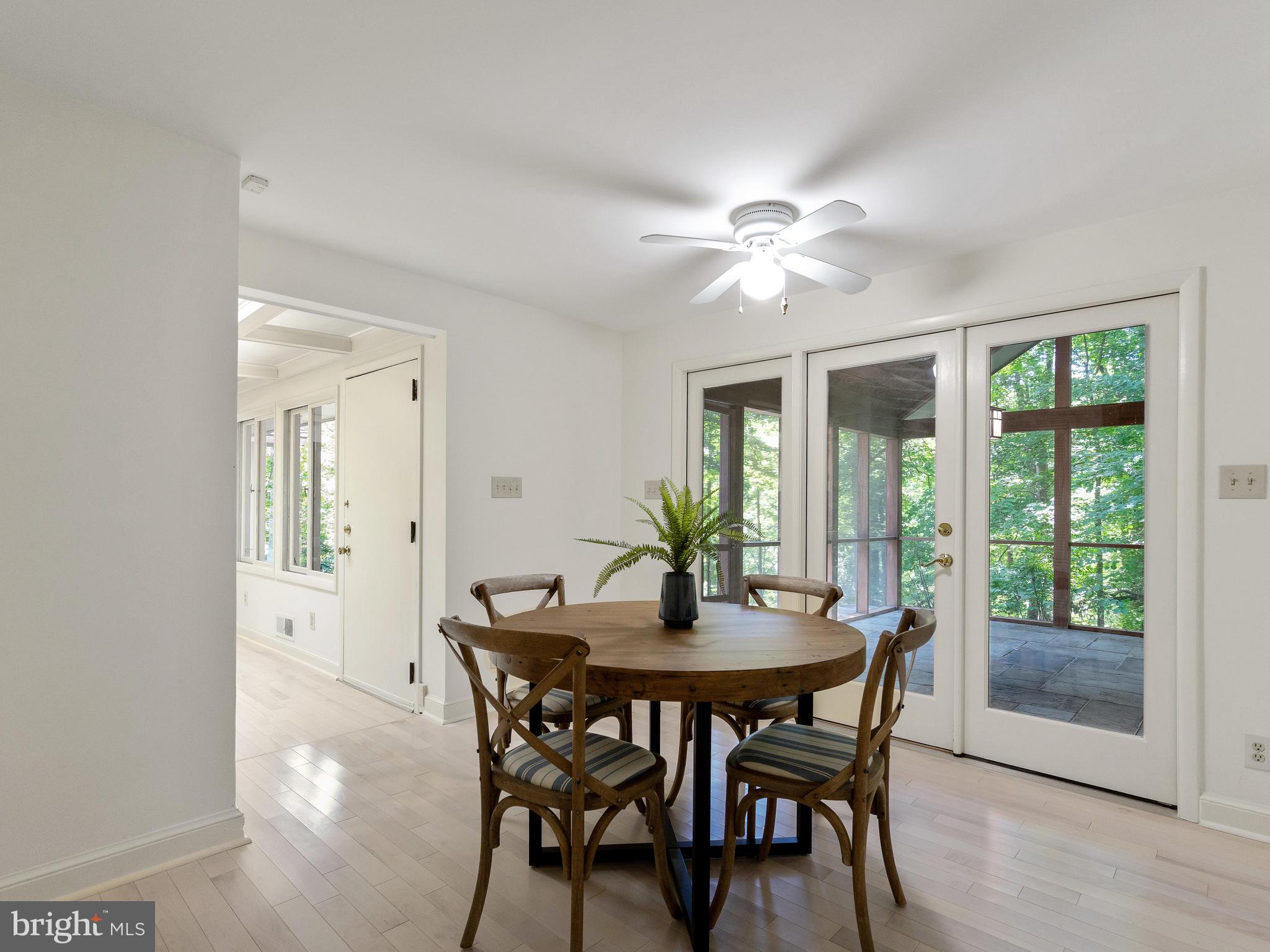 10420 Glen Road Potomac, MD 20854 - Photo 30 of 54 a view of a dining room with furniture window and wooden floor