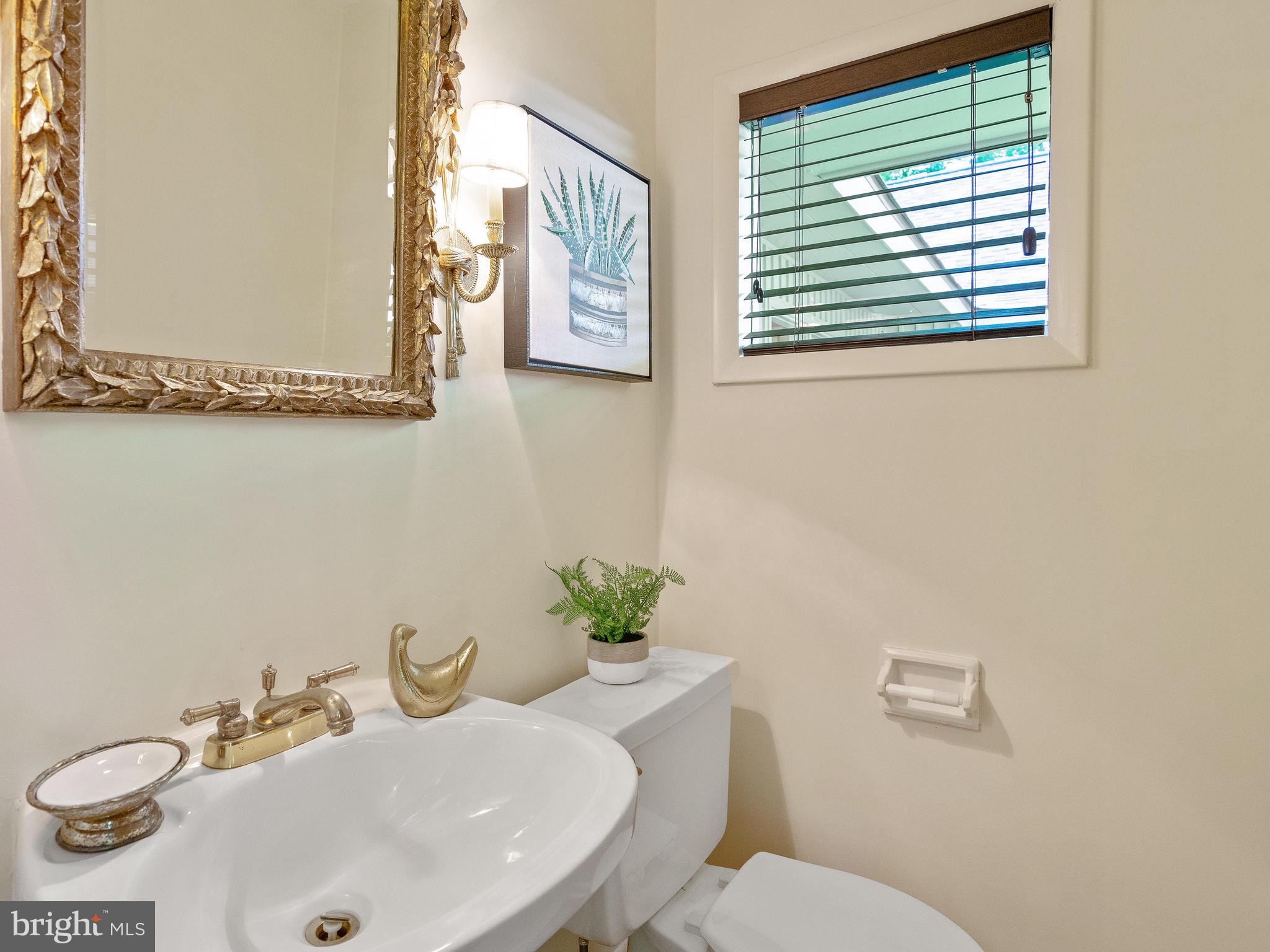 10420 Glen Road Potomac, MD 20854 - Photo 33 of 54 a bathroom with a sink and a mirror