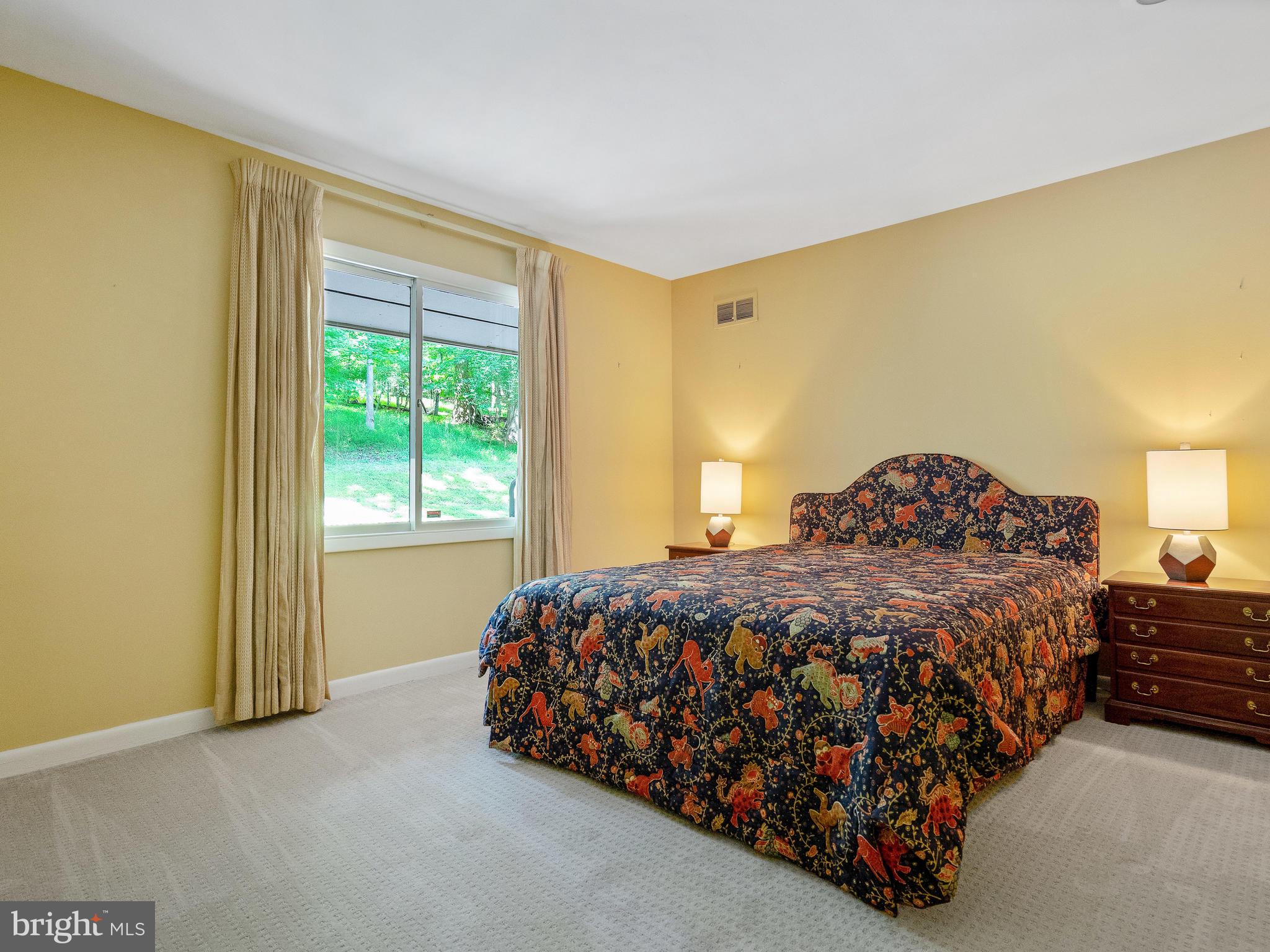 10420 Glen Road Potomac, MD 20854 - Photo 34 of 54 a bedroom with a bed lamp and a window