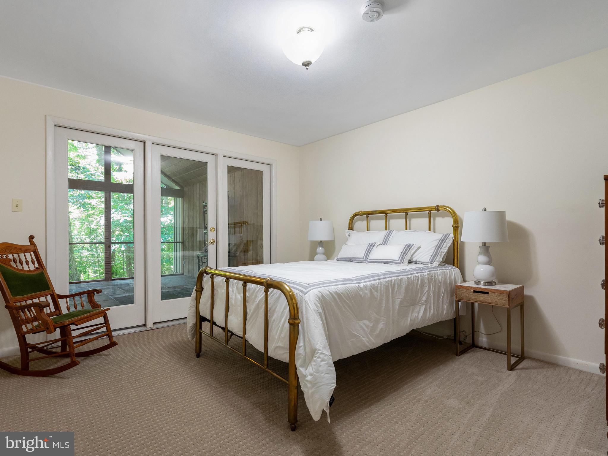 10420 Glen Road Potomac, MD 20854 - Photo 36 of 54 a bedroom with a bed chair and window