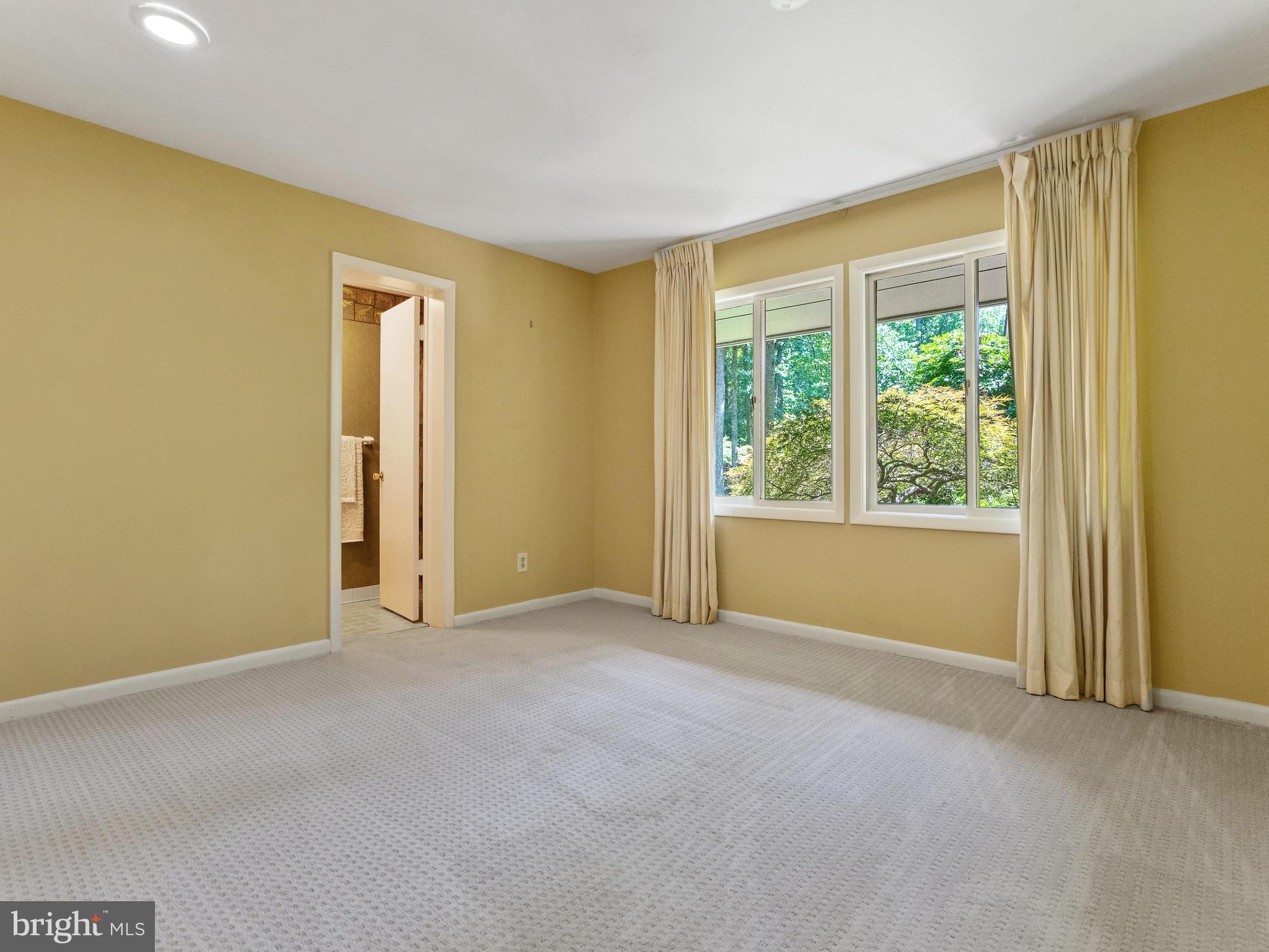 10420 Glen Road Potomac, MD 20854 - Photo 38 of 54 a view of an empty room with a window